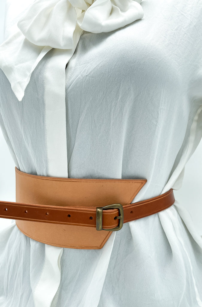 Handmade asymmetrical leather underbust belt with bronze buckles and adjustable strap for the perfect hourglass silhouette