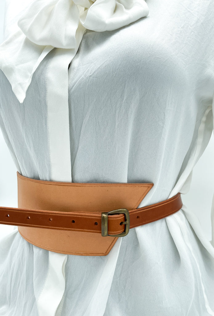 Handmade asymmetrical leather underbust belt with bronze buckles and adjustable strap for the perfect hourglass silhouette