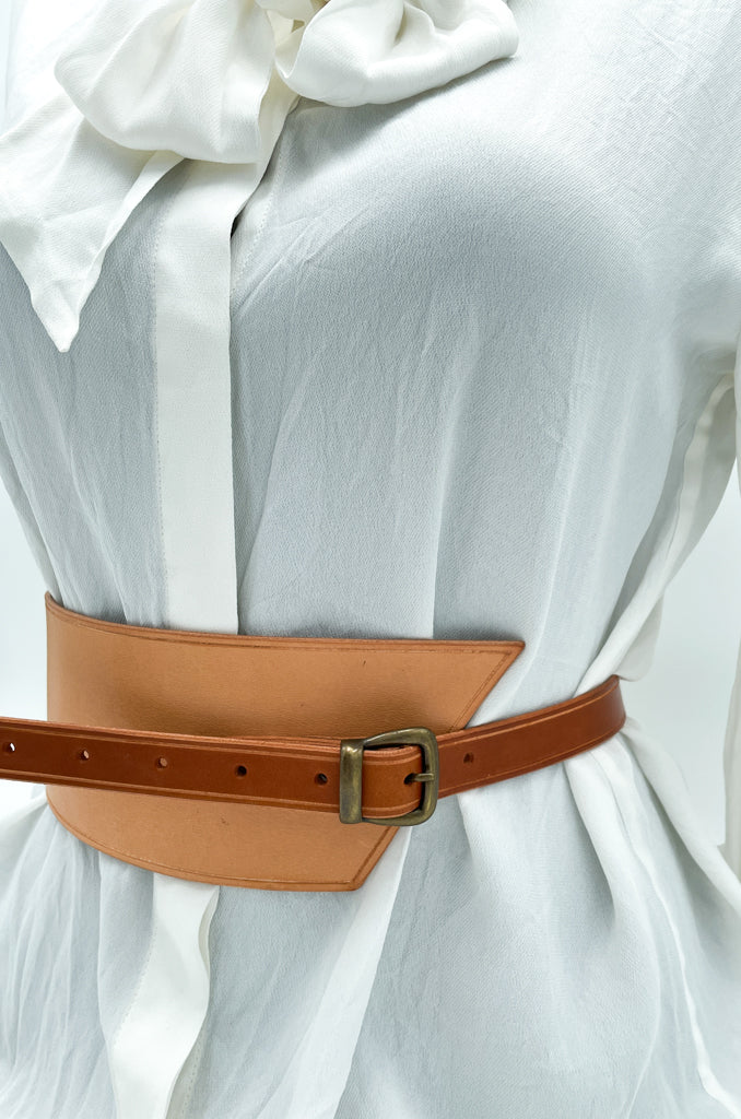 Handmade asymmetrical leather underbust belt with bronze buckles and adjustable strap for the perfect hourglass silhouette