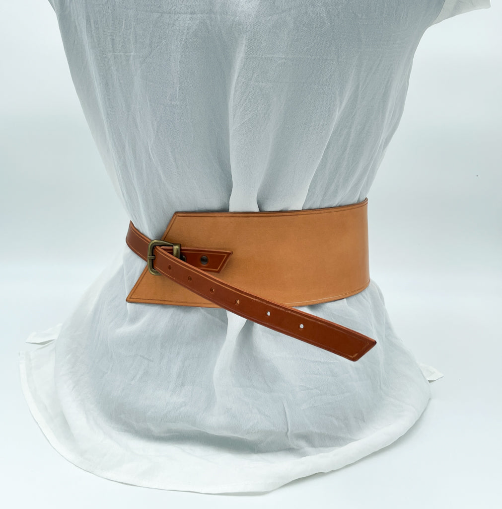 Handmade asymmetrical leather underbust belt with bronze buckles and adjustable strap for the perfect hourglass silhouette